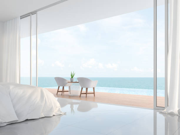 moderne luxus weißeschlafzimmer mit meerblick 3d render - hotel room contemporary summer sea stock-fotos und bilder