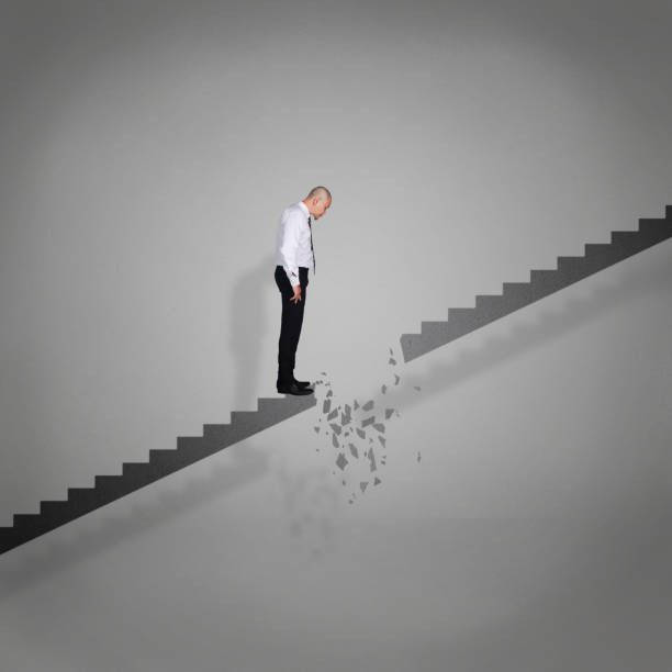 istock Businessman Looking Down on Broken Stairs 1185130953