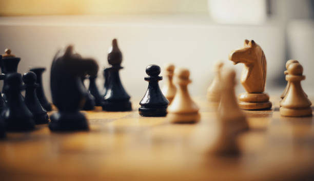 istock Wooden chess pieces on the chessboard. 1185132151