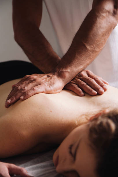istock Reiki session alternative therapies. Hands transmitting energy on the back 1185133221