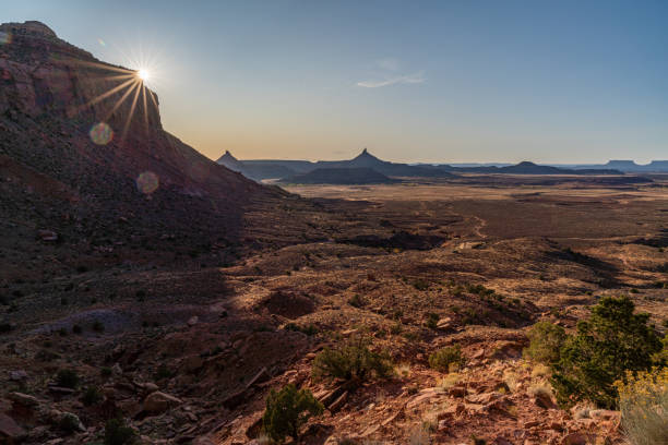 A woman hiking, climbing, and exploring the desert landscapes of Utah.