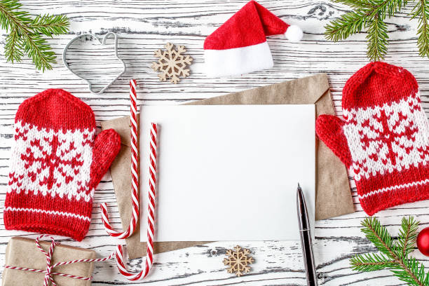 istock Christmas card mockup with Red Knitted Mittens. 1185159124