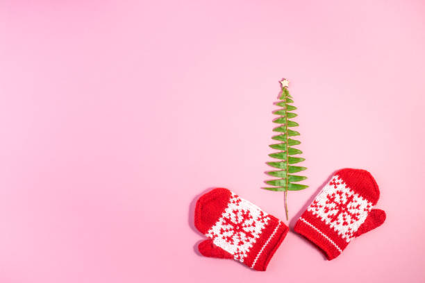istock Christmas Red Knitted Mittens with Snowflake Motives. 1185159159