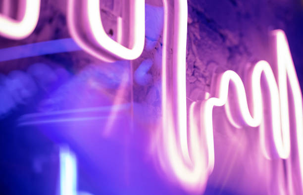 istock pink and purple abstract blurred neon lights background, texture for design 1185161353
