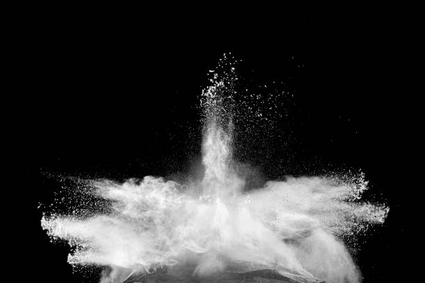 istock Freeze motion of white dust particles splash on black background.White powder explosion clouds. 1185163042