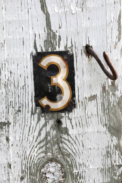 istock Number 3 on Distressed, weathered wood background 1185164157