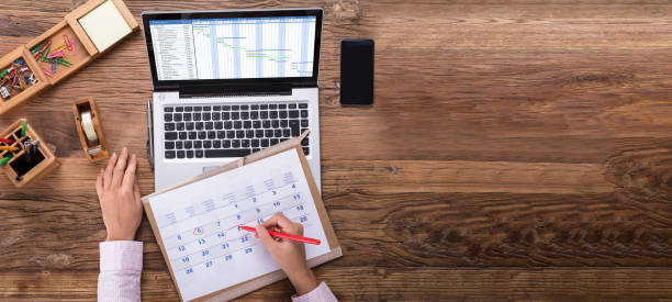 istock Businesswoman Scheduling The Plan Using Calendar And Laptop 1185170001
