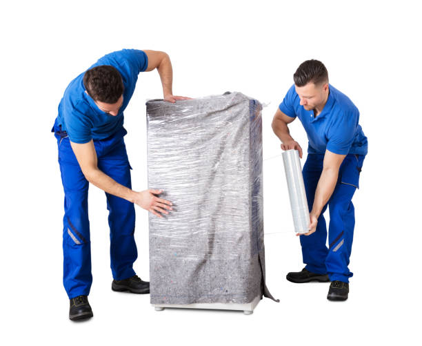 istock Male Movers Wrapping The Home Appliances With Plastic Wrap 1185170056