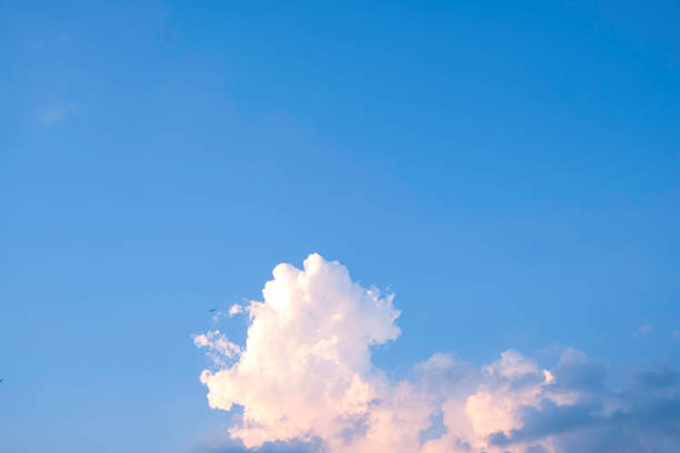 istock white fluffy clouds blue sky in summer day 1185172601