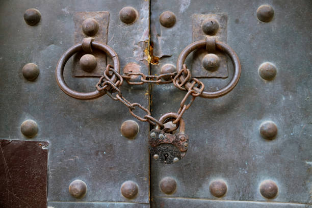 Old metal medieval door with chain lock, Texture background