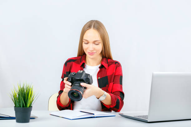 istock Young photographer or graphic designer at work in office or home. 1185177106