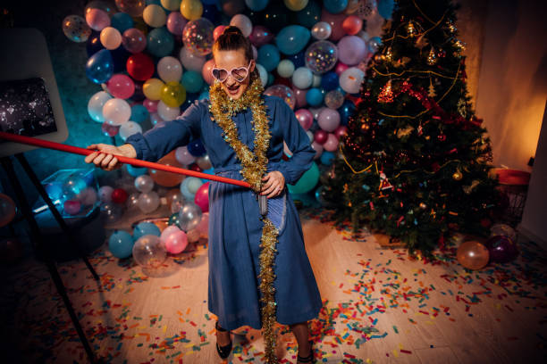 istock Dancing and cleaning after new year party 1185178570