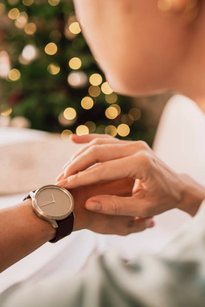 Time for christmas woman looking at watch