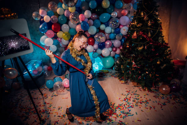 istock Cleaning and dancing after new year party 1185178712