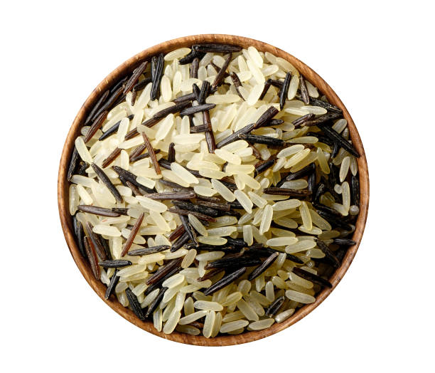 riso misto in ciotola di legno isolato su bianco. - clipping path rice white rice basmati rice foto e immagini stock