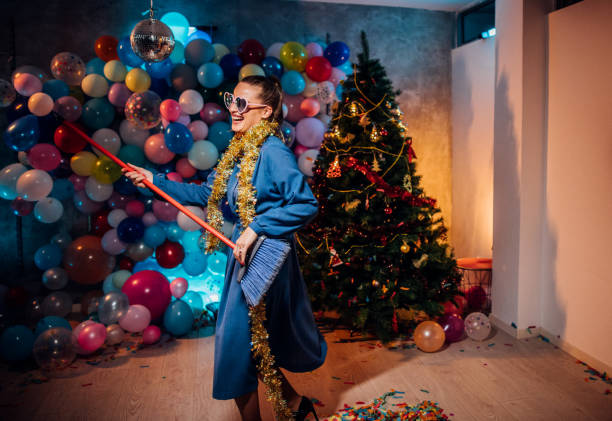istock Sweeping the house after new year party 1185179120