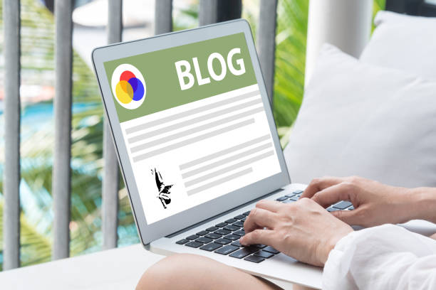 istock Women sit at work writing blog 1185180180