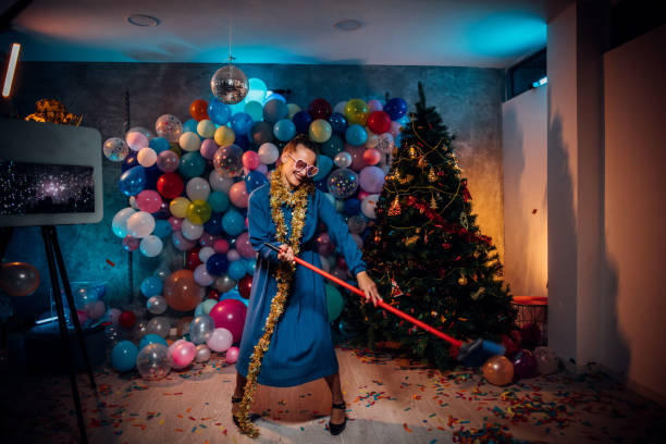 istock Dancing and cleaning after new year party 1185180375