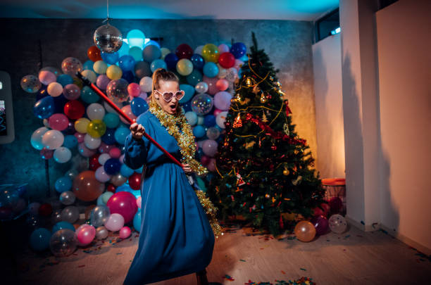 istock Cleaning and dancing after new year party 1185180386