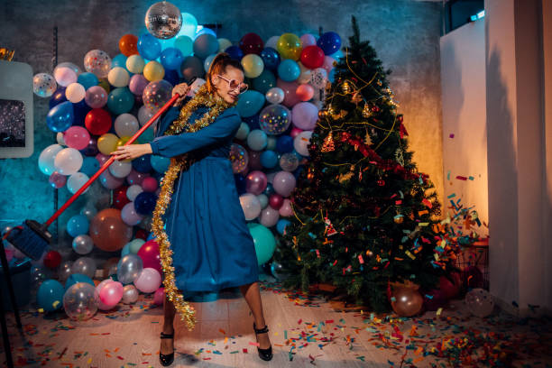 istock Cleaning and dancing after new year party 1185180395