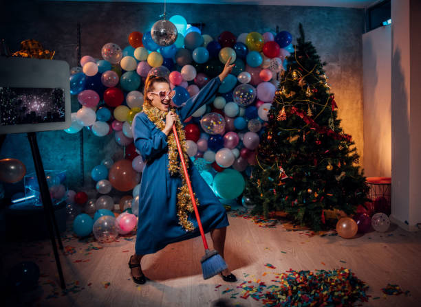 istock Dancing and cleaning after new year party 1185181187