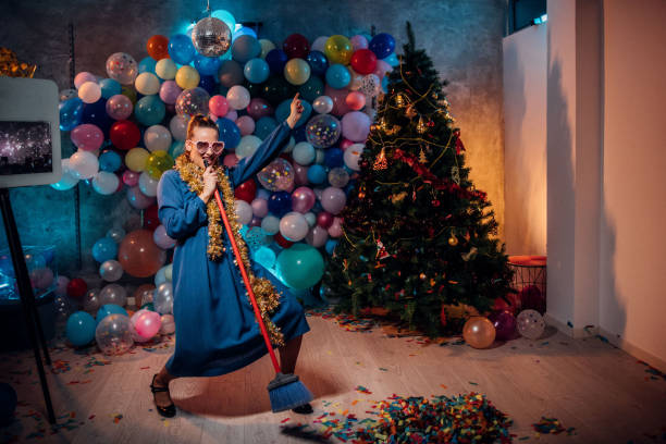 istock Dancing and cleaning after new year party 1185181238