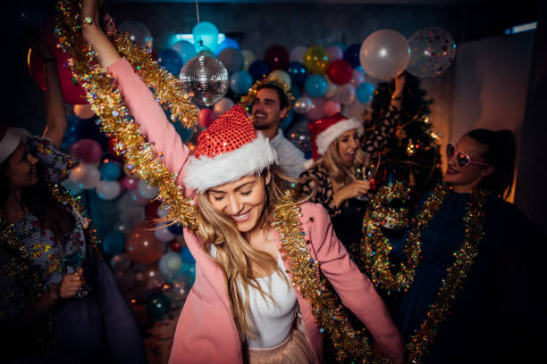 Group of friends having a new year party  and dancing