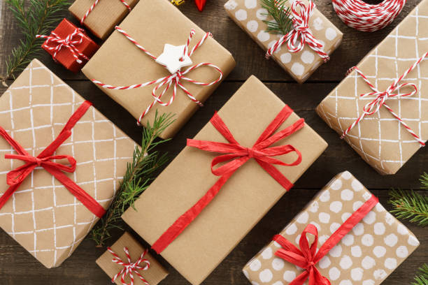 istock Christmas gift boxes and decoration on wooden background. 1185182200