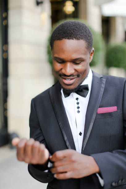 istock Afro american happy man wearing suit and smiling 1185184813
