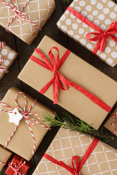 istock Christmas gift boxes and decoration on wooden background. 1185184862