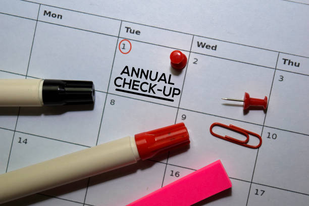 Annual Check-up text on white calendar background. Reminder or schedule concept stock photo