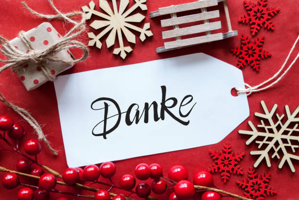 Bright Red Christmas Decoration, Label, Danke Means Thank You stock photo