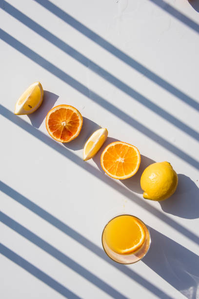 istock Refreshment drinks on astone table . Summer tropical mood with artistic geometric shadows. 1185189744