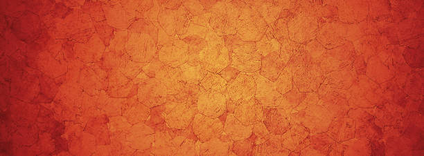 istock Horizontal yellow and orange grunge texture cement or concrete wall banner, blank background 1185189973