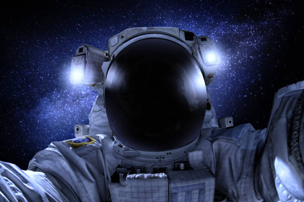 istock Astronaut or cosmonaut in the universe closeup 1185190667