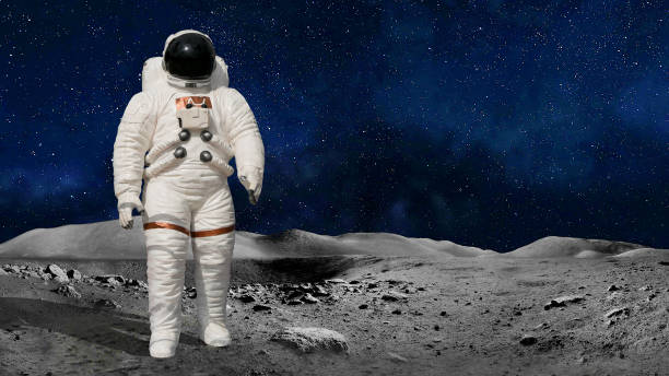 istock Astronaut or cosmonaut in the universe standing on the moon or planet surface. Element of image kindly provided by NASA 1185190672