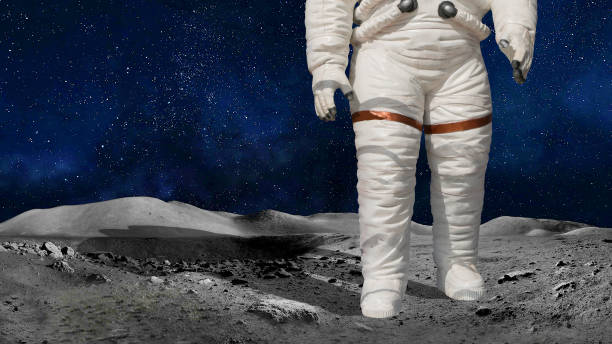 istock Astronaut or cosmonaut closeup in the universe standing on the moon or planet surface. Element of image kindly provided by NASA 1185190678