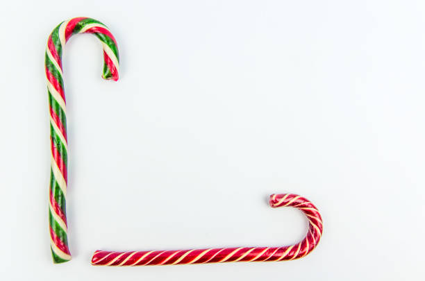 istock Christmas background. Two different Christmas candy canes 1185191983