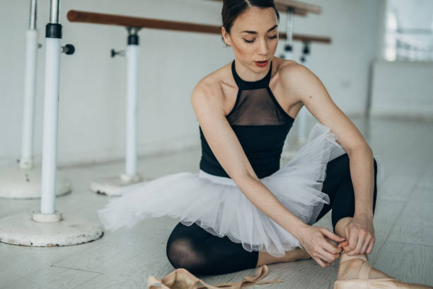 istock Young Woman Preparing for Ballet Training 1185193060