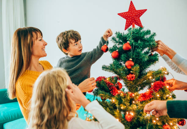 istock Family decorating the Christmas tree 1185193212