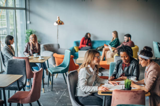 istock Group of friends sitting in cafe 1185194977