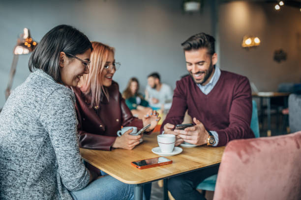 istock Group of friends sitting in cafe 1185195516