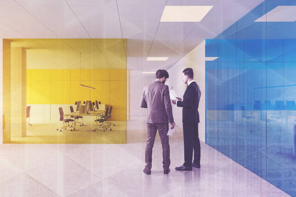 istock People in blue and yellow office 1185196693