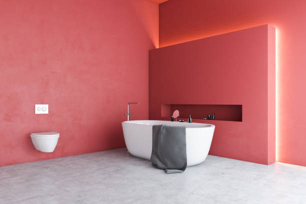 istock Red bathroom corner with tub and toilet 1185197084