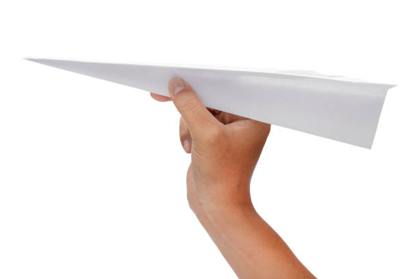 istock paper plane in hand isolated on white background - clipping paths. 1185197300