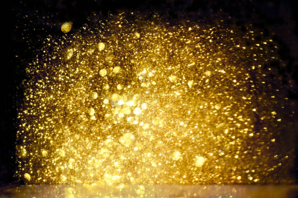 istock golden glitter bokeh lighting texture Blurred abstract background for birthday, anniversary, wedding, new year eve or Christmas 1185198092