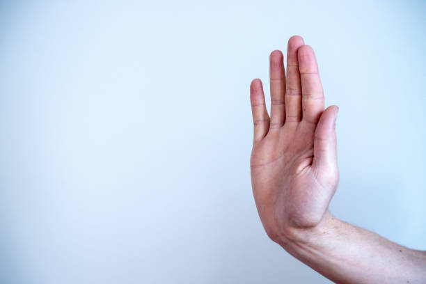 istock Defense or stop gesture: Male hand with stop gesture 1185198385