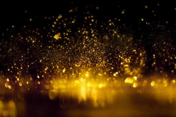 istock golden glitter bokeh lighting texture Blurred abstract background for birthday, anniversary, wedding, new year eve or Christmas 1185198576