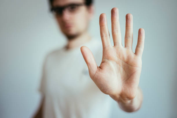 istock Defense or stop gesture: Male hand with stop gesture 1185198666