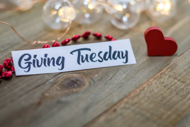 Giving Tuesday donate charity concept on wooden board stock photo